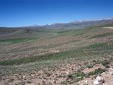 02 Deosai Plains Above Skardu The Deosai Plain is a high alpine plateau scattered with small tufts of grass and small flowers.